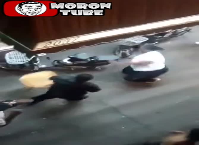 Video :When she uses a cane to steady a man, he strikes her with a chair (Warning to the audience)